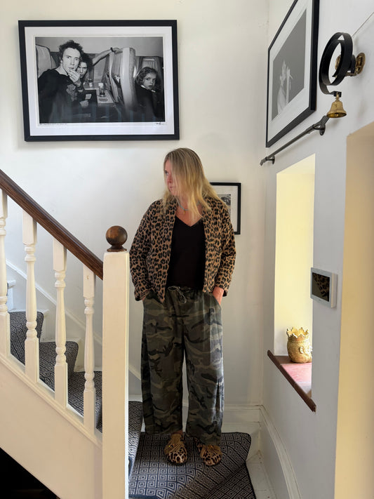 Front view of woman wearing Jaipur Tan leopard print quilted jacket